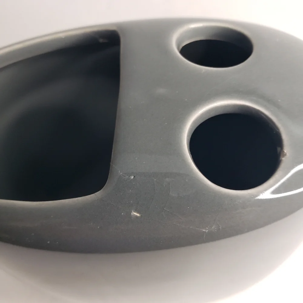 Ceramic toothbrush and toothpaste holder. 171
